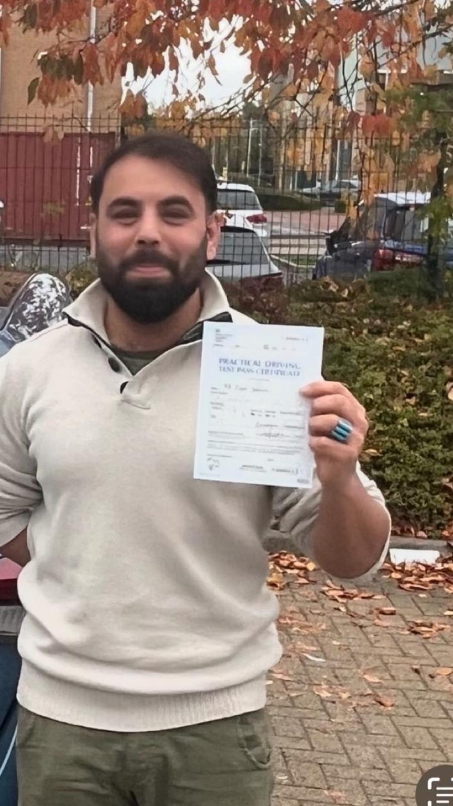 Student celebrating passing their driving test