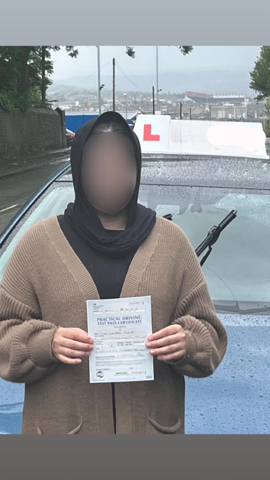 Student celebrating passing their driving test