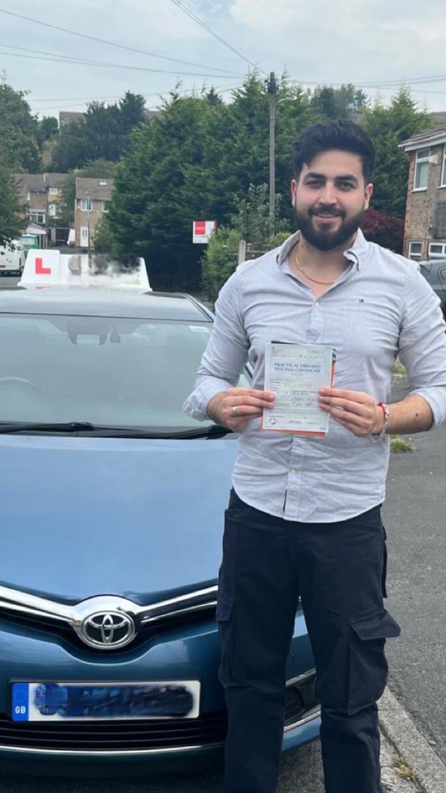 Student celebrating passing their driving test