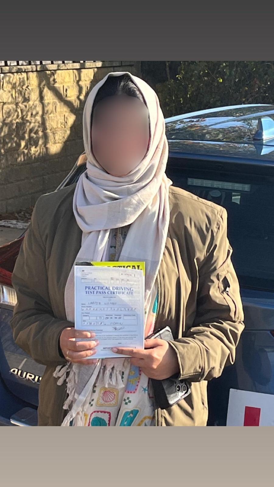 Student celebrating passing their driving test