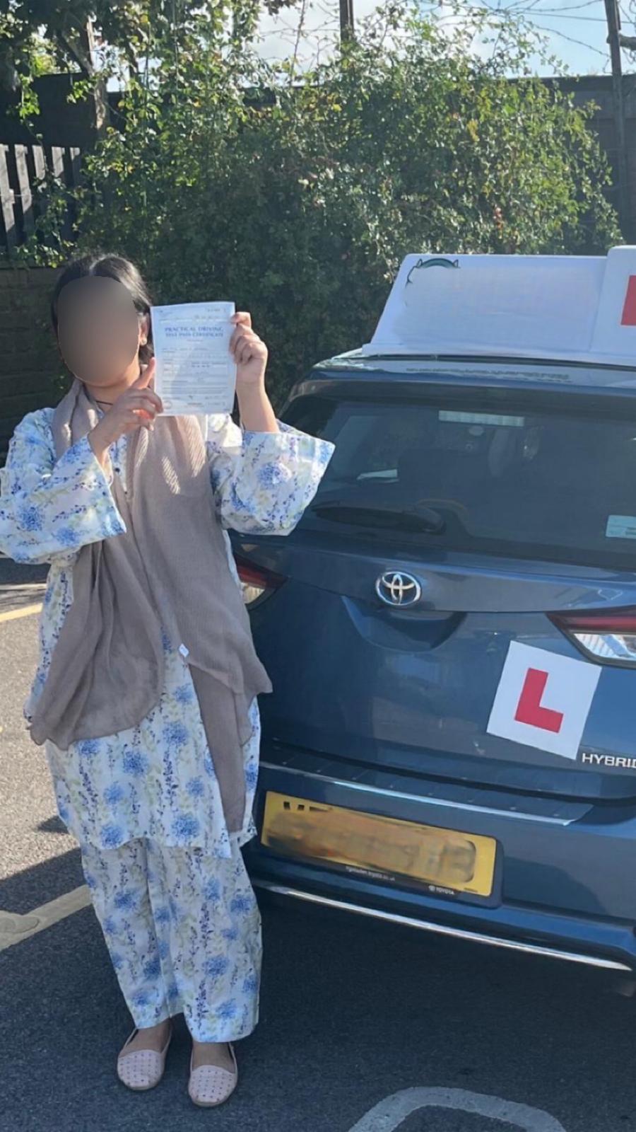 Student celebrating passing their driving test