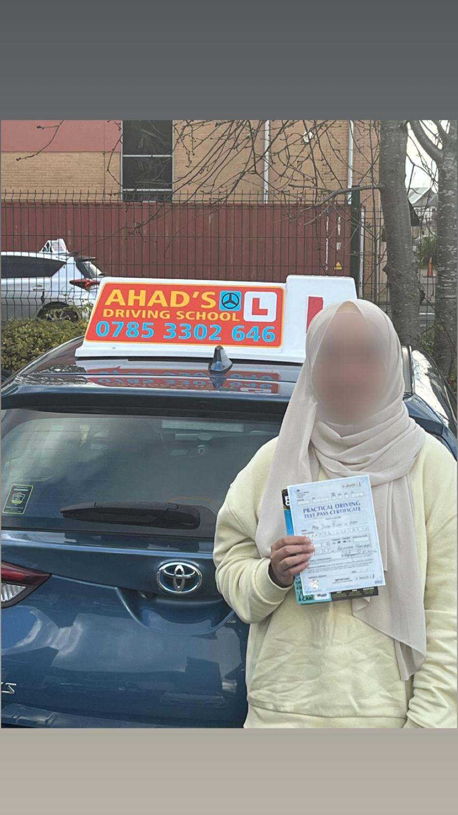 Student celebrating passing their driving test