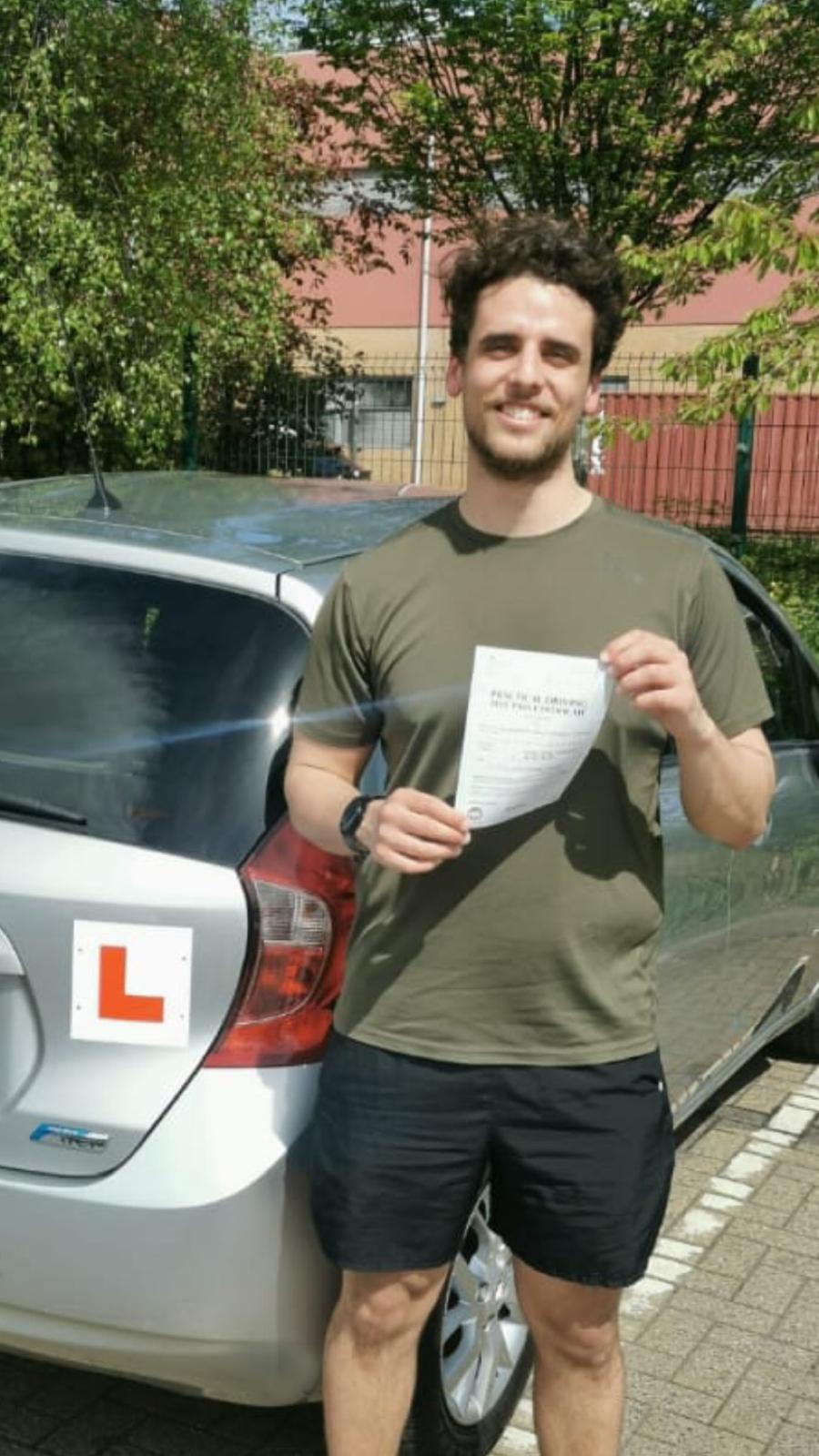 Student celebrating passing their driving test