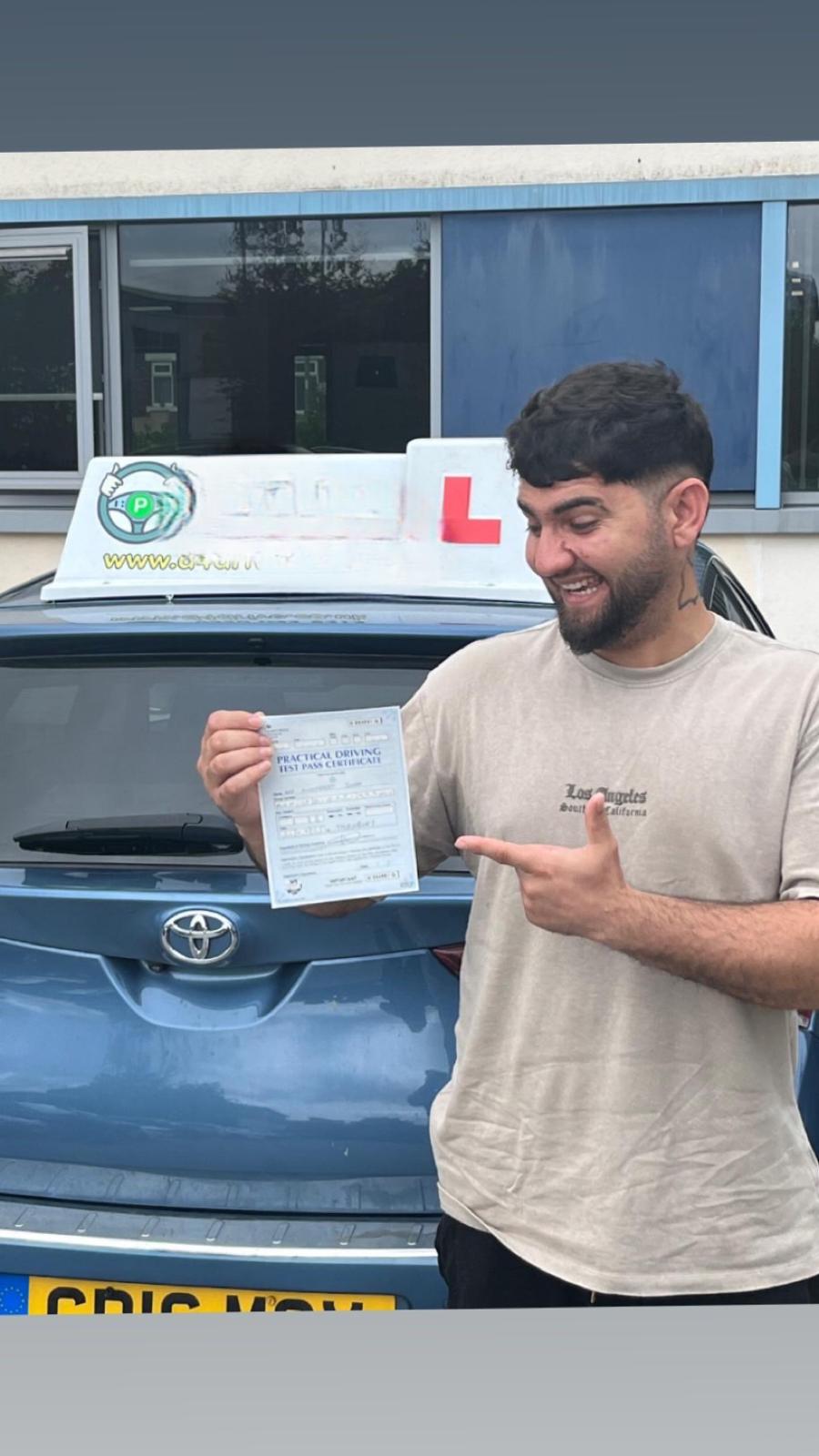 Student celebrating passing their driving test